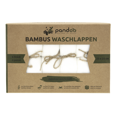 Hier sieht man die Verpackung der Waxchlappen. Oben seht die Firma Pandoo, unten drunter dann Bambus Waschlappen. Die Verpackung ist braun. In der Mitte ist ein Fenster in der man 4 Waschlappen sehen kann. Diese sind mit Kordel und Schleife gebunden.